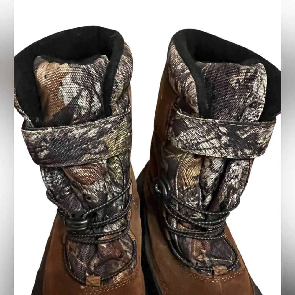 Ozark Trail Men's Winter Pac Boots with a Mossy Oak camouflage and suede upper.